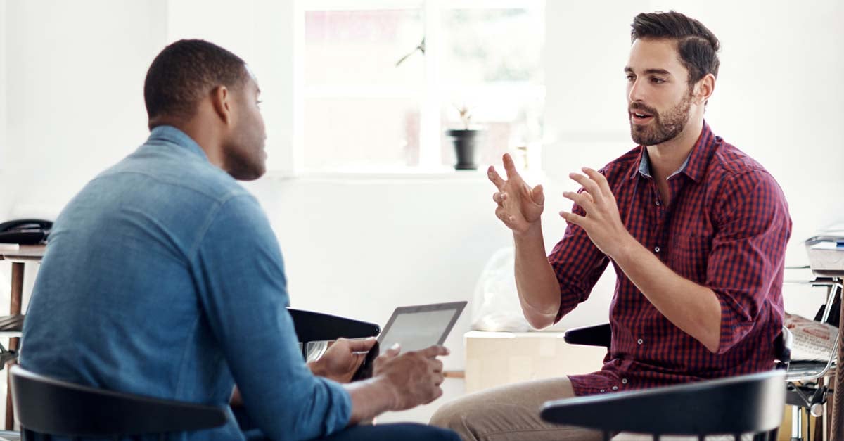 Servicemember and civilian mentor discussing career-training goals