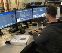 Matthew Hall working from his dispatcher console at FHP JRCC