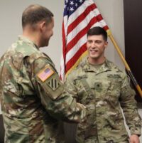 Matthew Hall promoted to Specialist by Lieutenant Colonel Henry