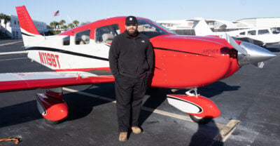 Ovidio Gonzalez in front of a Piper Archer DX Aircraft