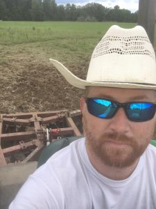McKibben harrowing his Monticello farm in preparation for crimson clover.